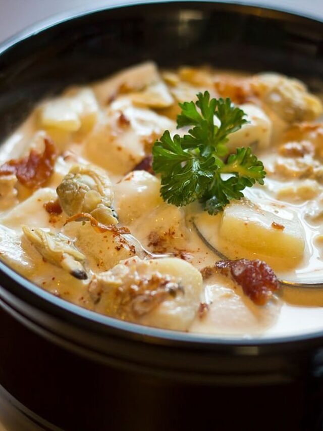 Creamy New England Clam Chowder garnished with parsley