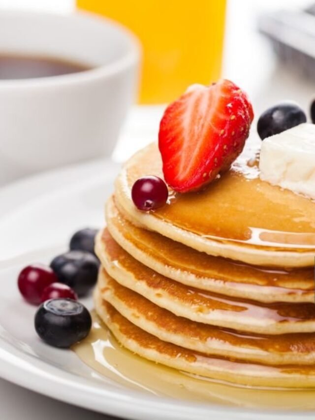 Stack of delicious pancakes with fresh berries